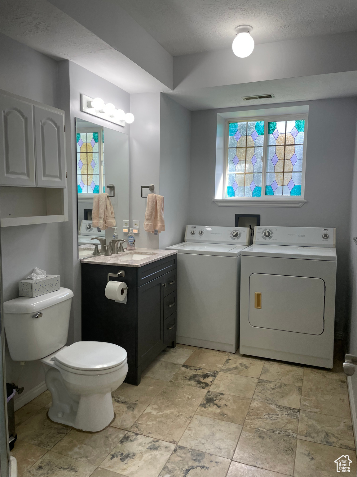 Large 3/4 Bathroom with Washer Dryer, and slider window for fresh air, scenery and light. Nice location in home!