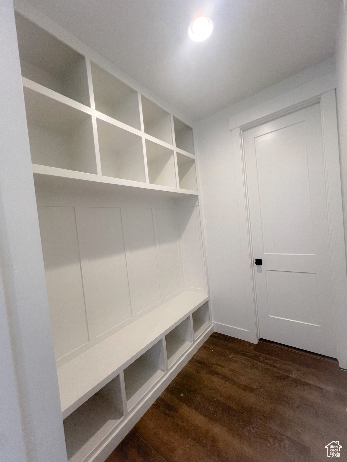 Mudroom with dark hardwood / wood-style flooring