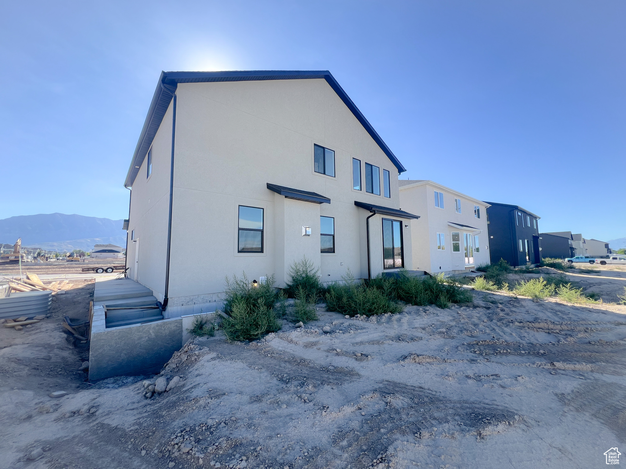 View of side of home featuring a mountain view