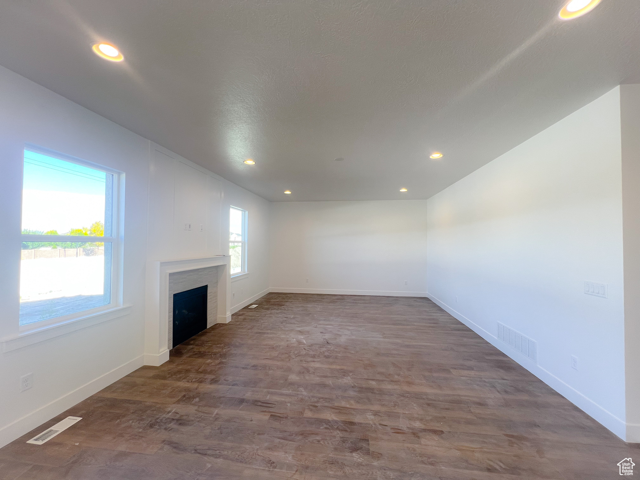 Unfurnished living room with hardwood / wood-style floors