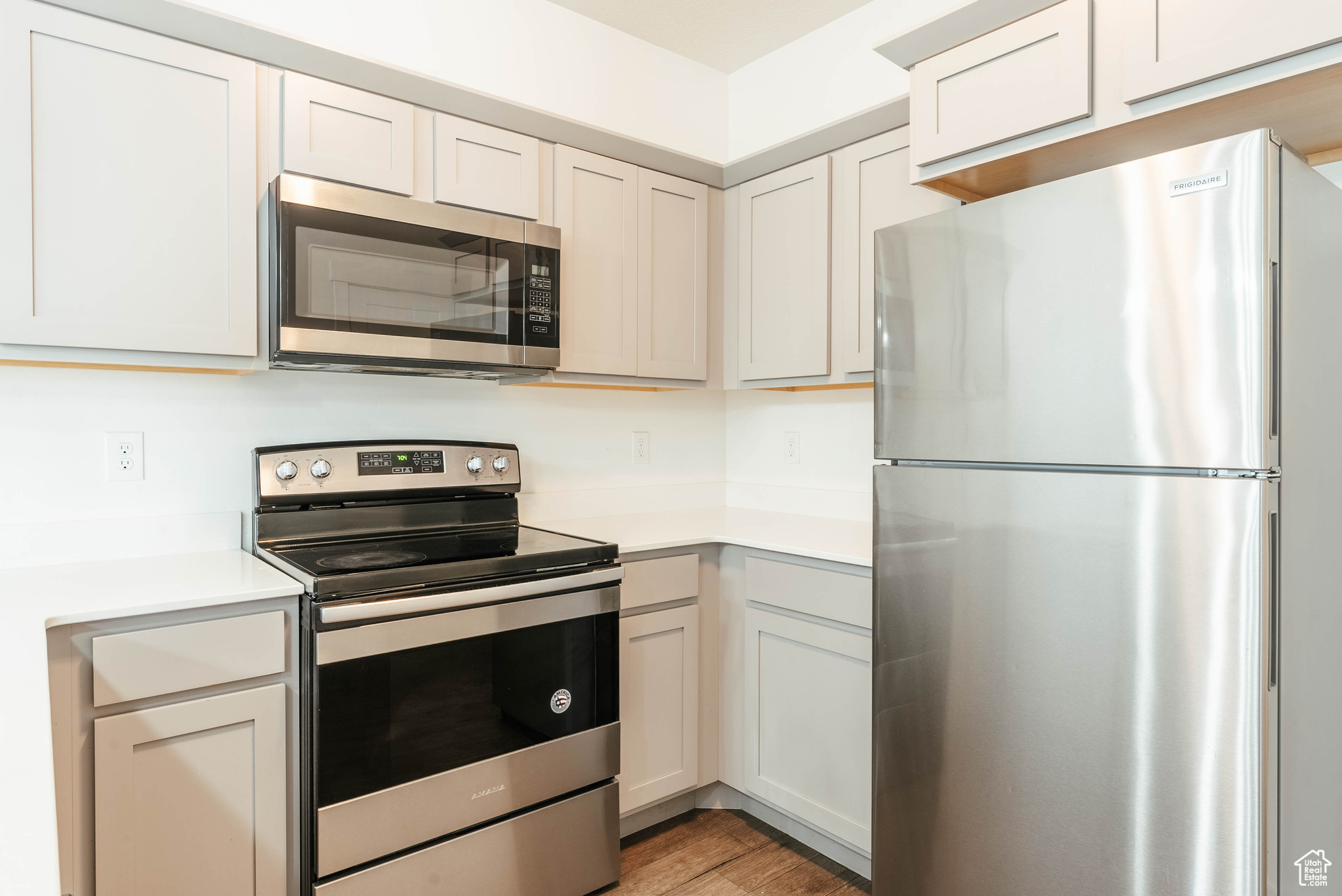 Kitchen featuring appliances with stainless steel finishes and light hardwood / wood-style floors