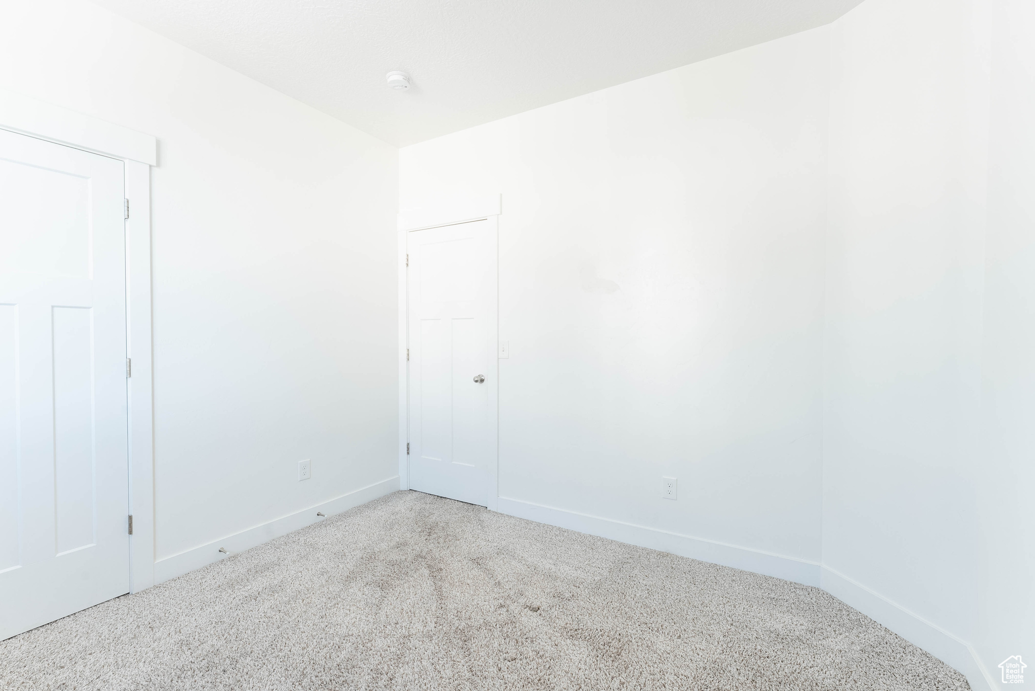 Empty room featuring carpet floors