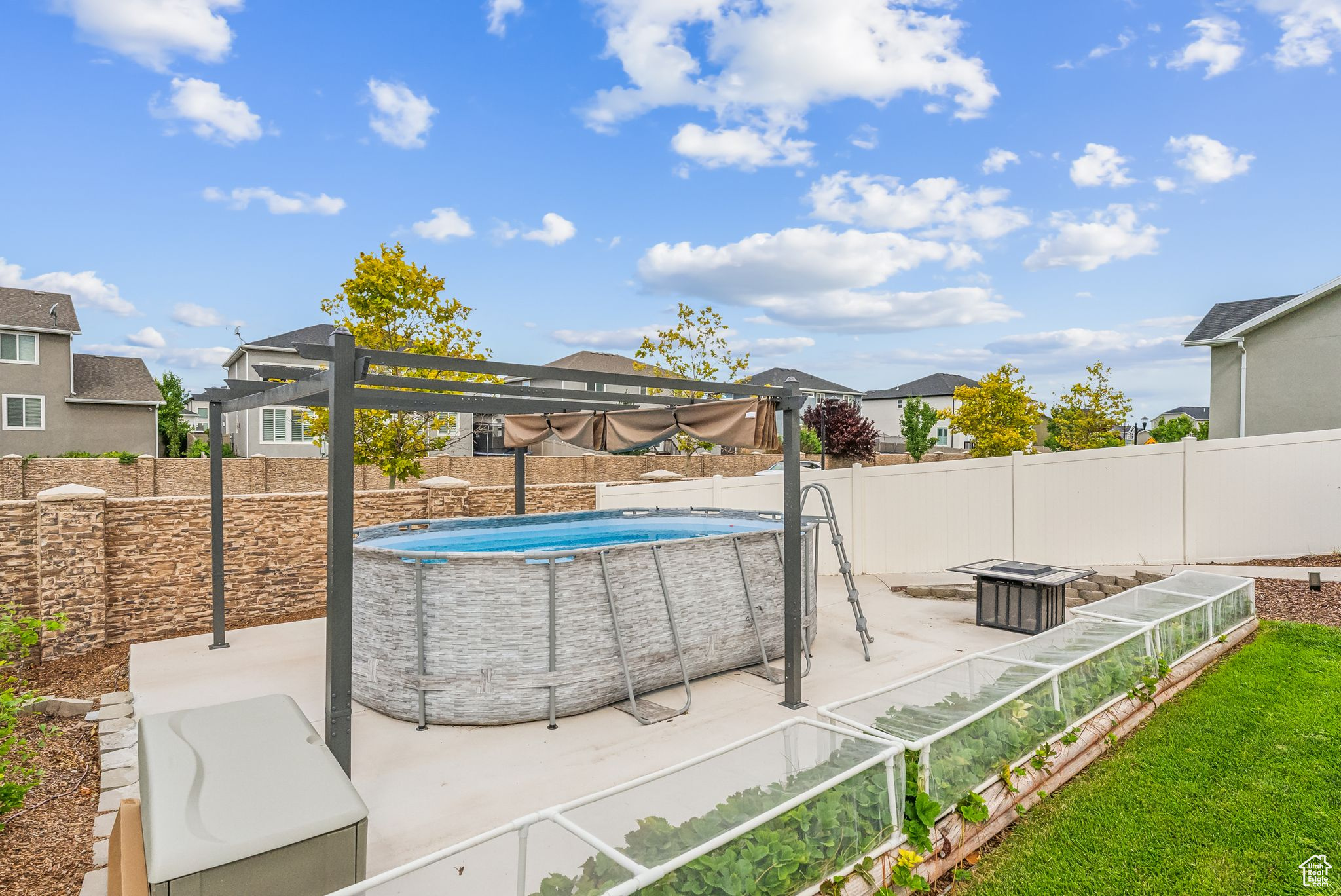 View of swimming pool with a patio area