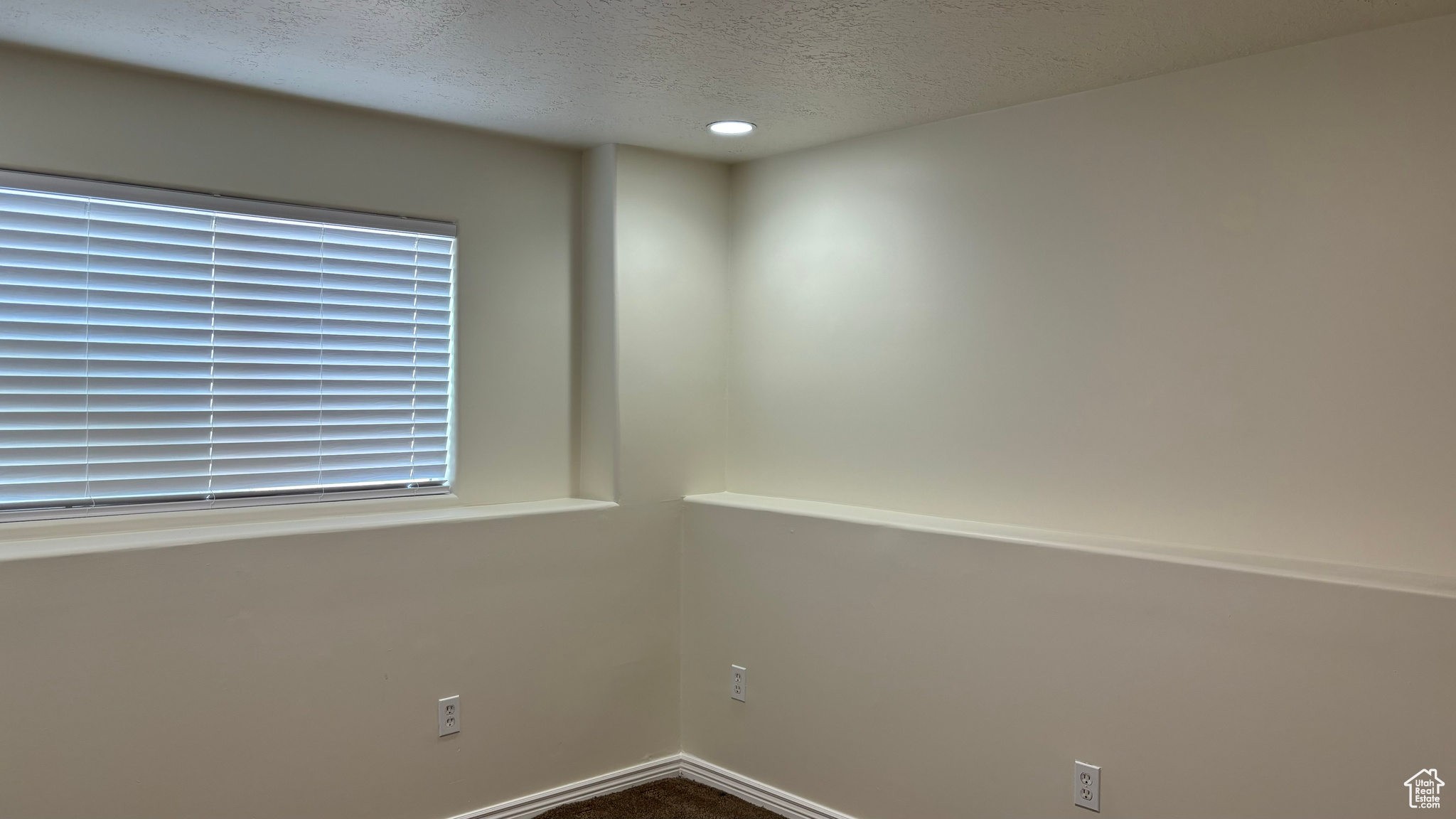 Spare room with a textured ceiling