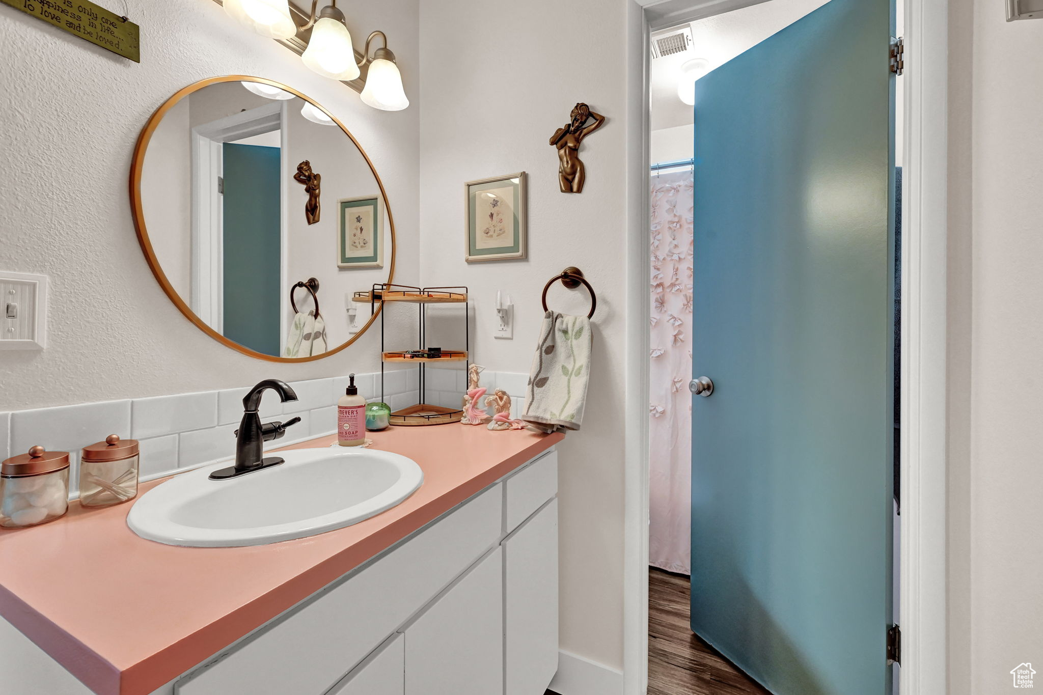 Bathroom with vanity and hardwood / wood-style floors