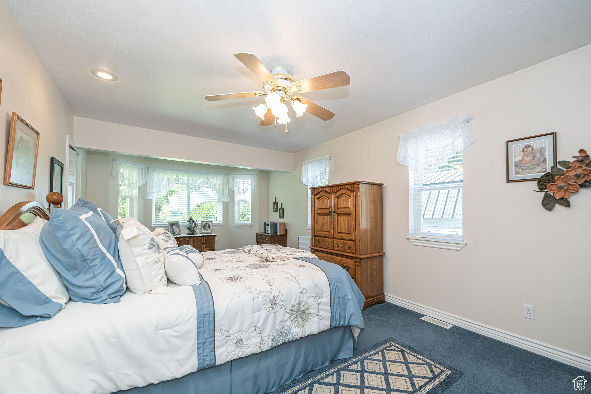 Primary Suite ceiling fan and carpet