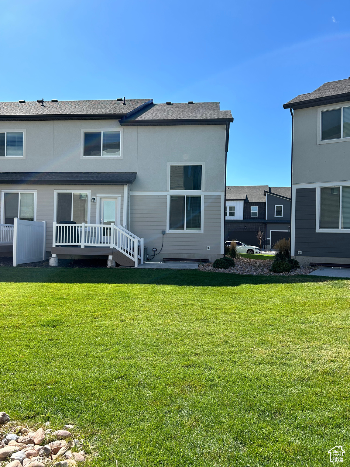 Back of house featuring a yard