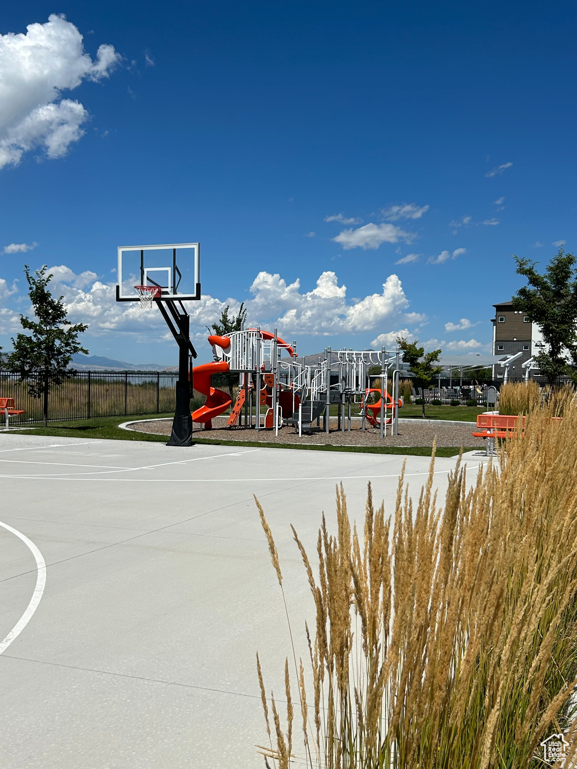 View of basketball court & playground