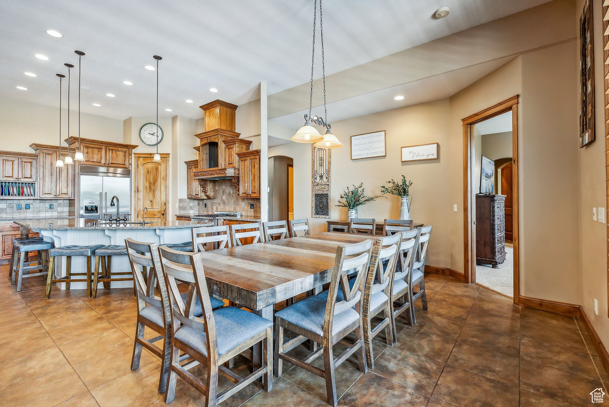 Dining space with sink and dark tile patterned floors