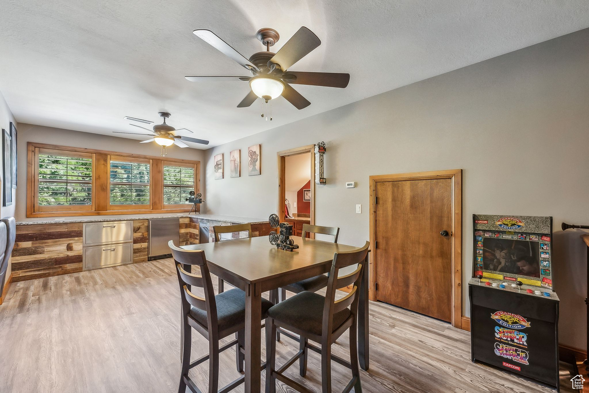 Dining room featuring ceiling fan and light hardwood / wood-style floors