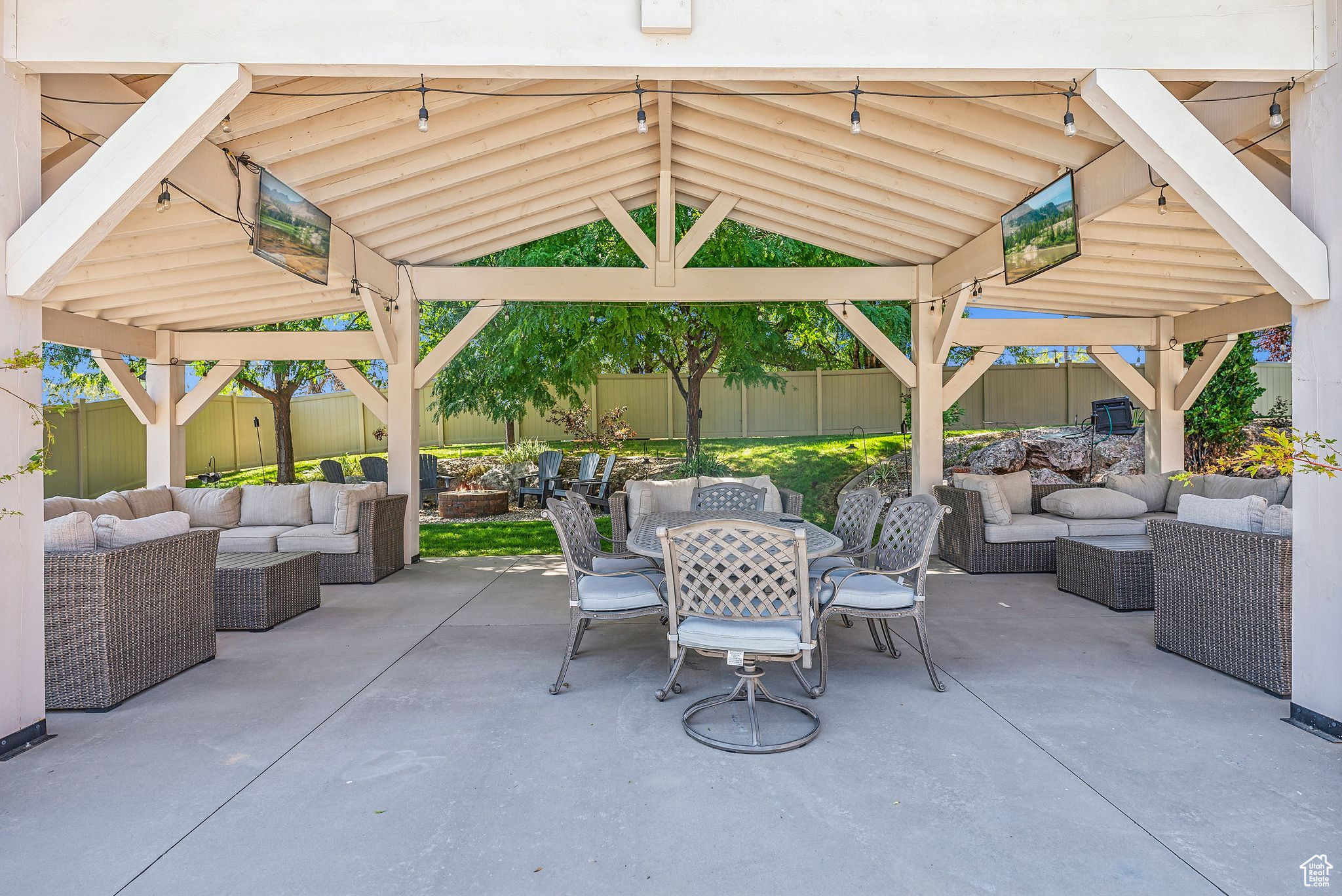 View of patio with an outdoor living space and a gazebo