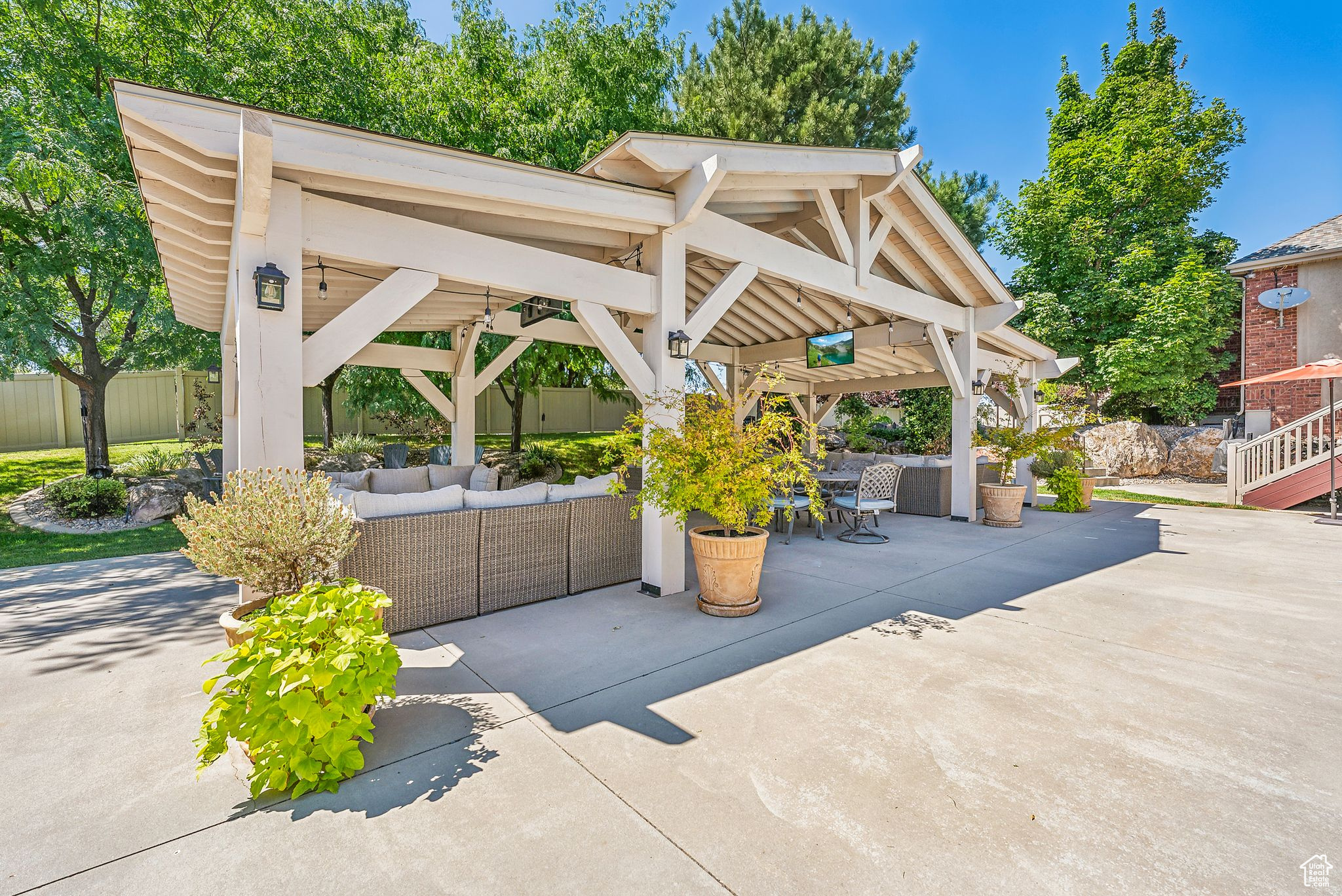 View of patio featuring an outdoor living space and a gazebo