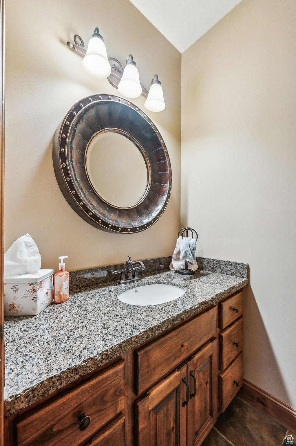 Bathroom featuring vanity and tile patterned floors