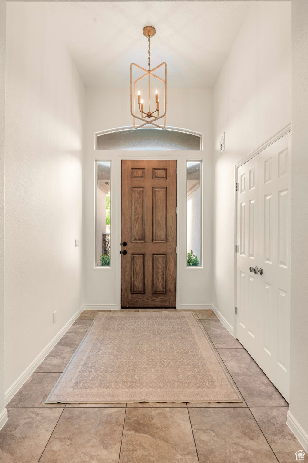 Foyer featuring a chandelier