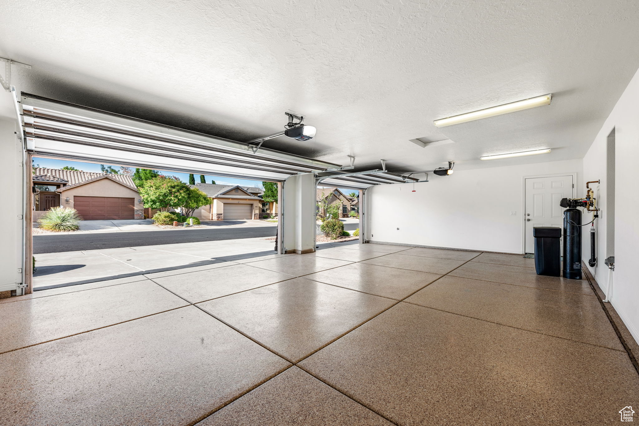 3 Garage with a garage door openers, epoxy floors, 50 gal water heater, water softener