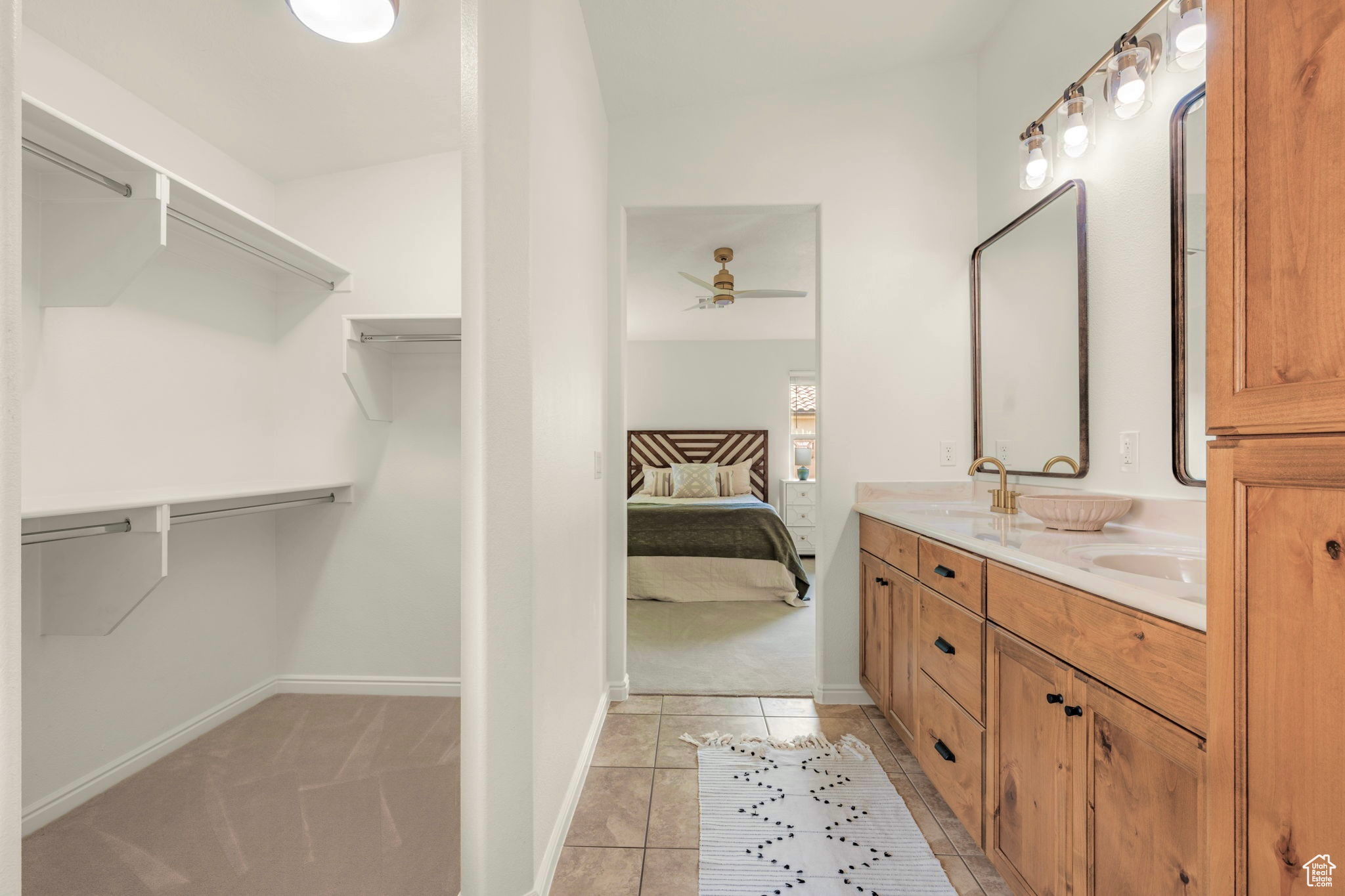 Interior space with vanity and tile patterned flooring