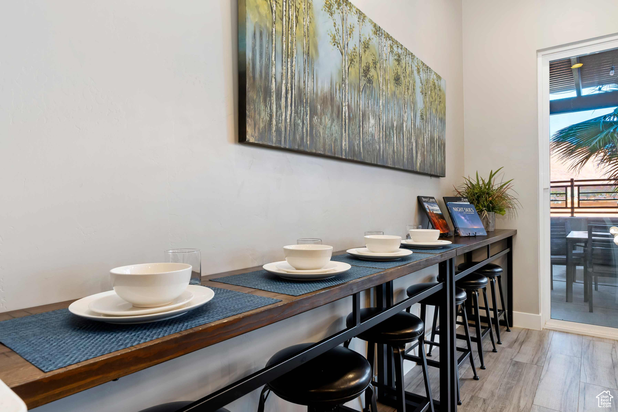 Dining area with hardwood / wood-style floors