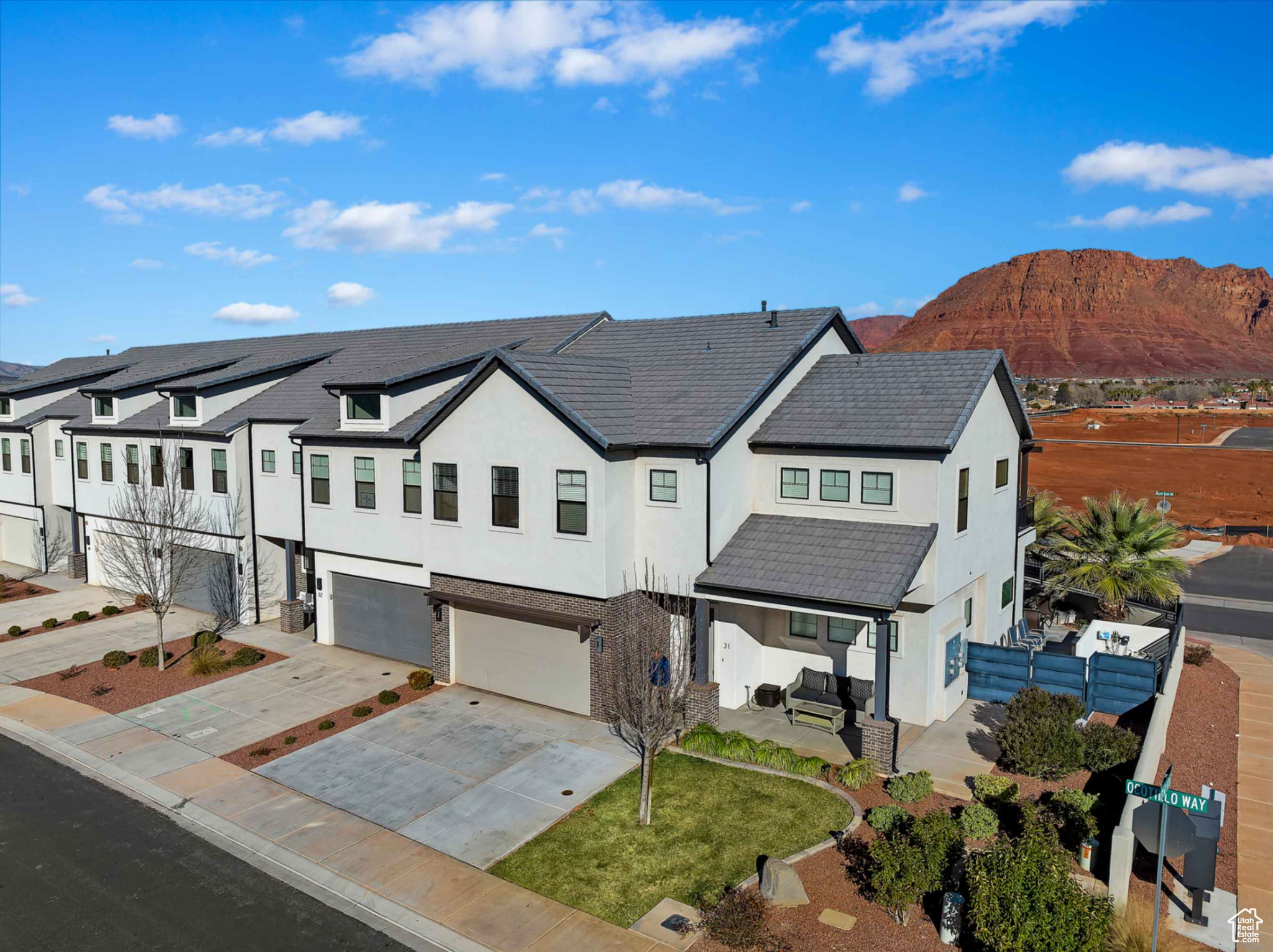 View of front of property with a mountain view and a garage