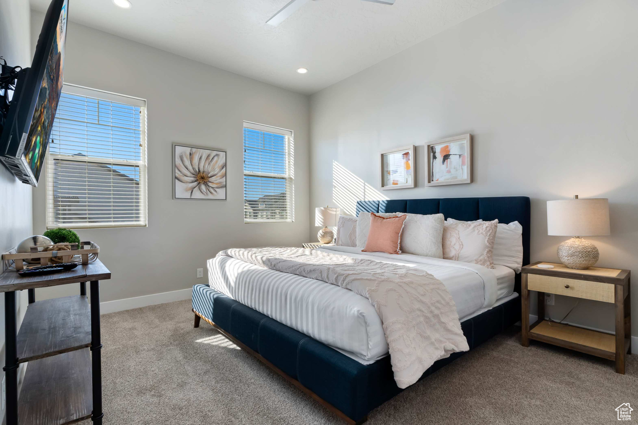 Bedroom featuring ceiling fan and carpet