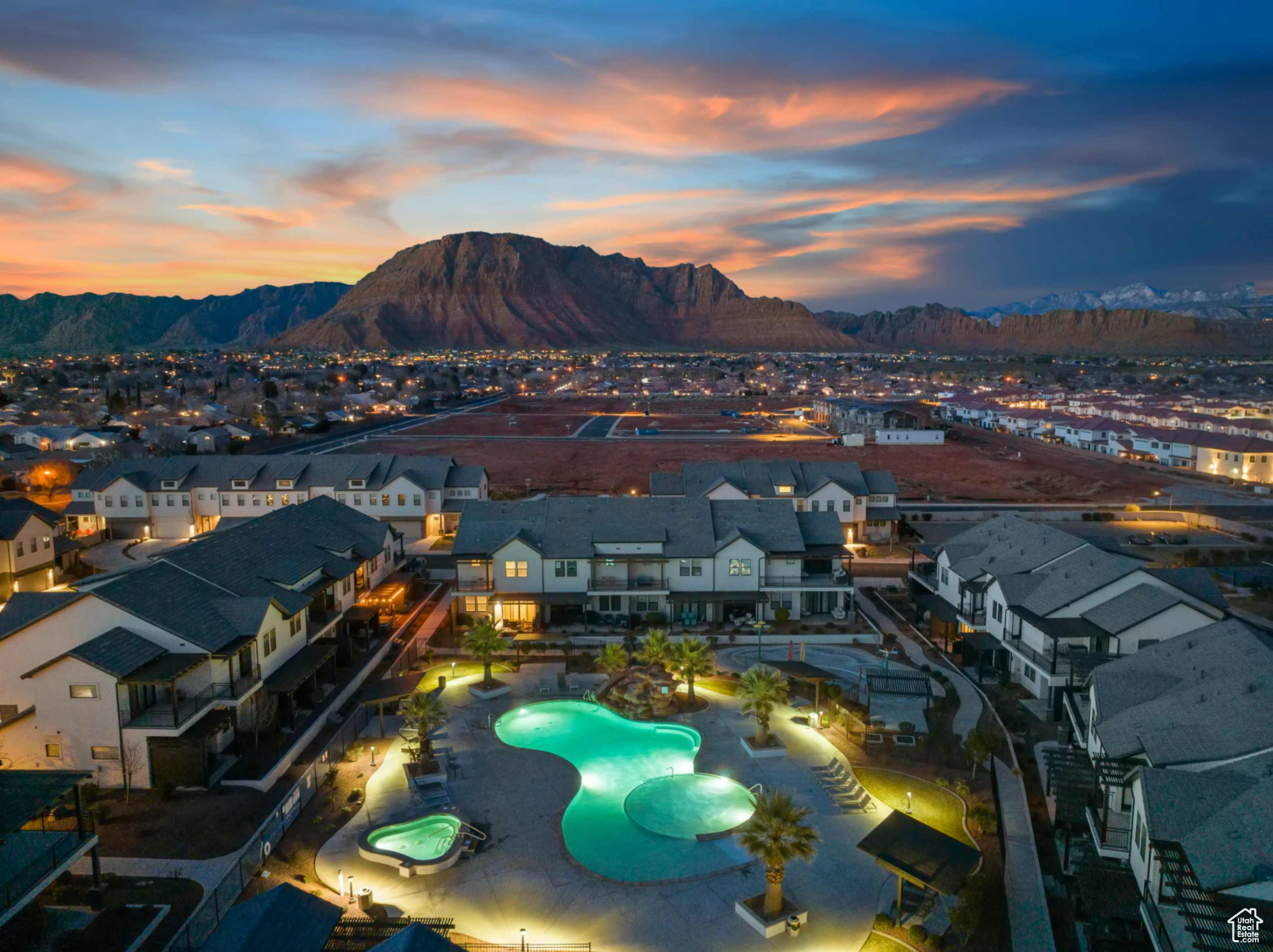 Aerial view at dusk featuring a mountain view