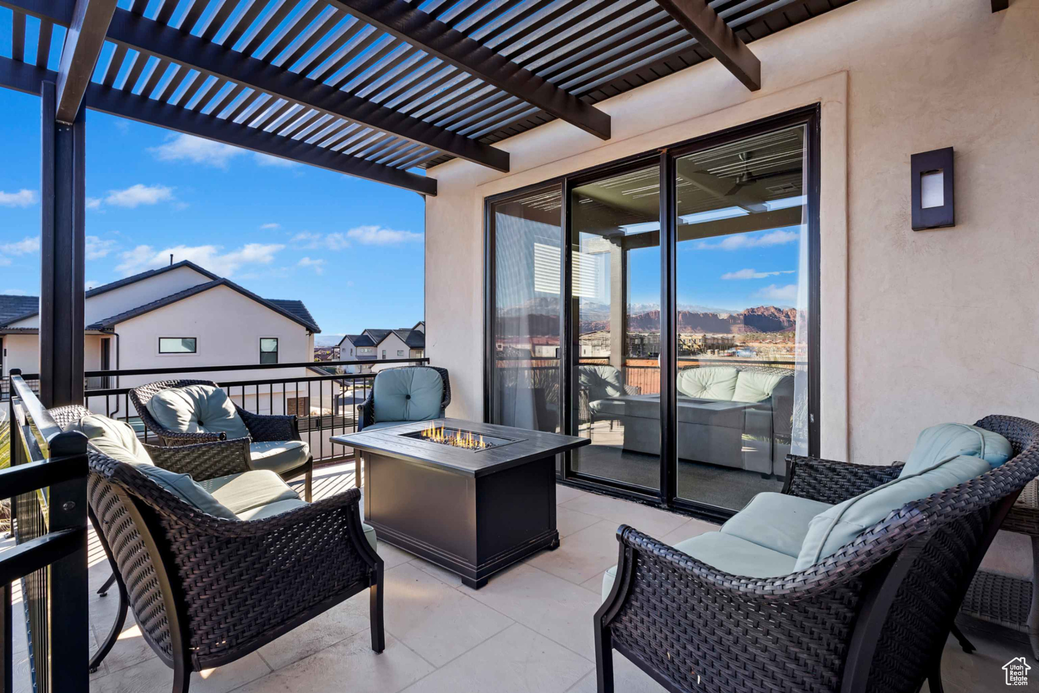 View of patio / terrace featuring an outdoor living space with a fire pit and a pergola