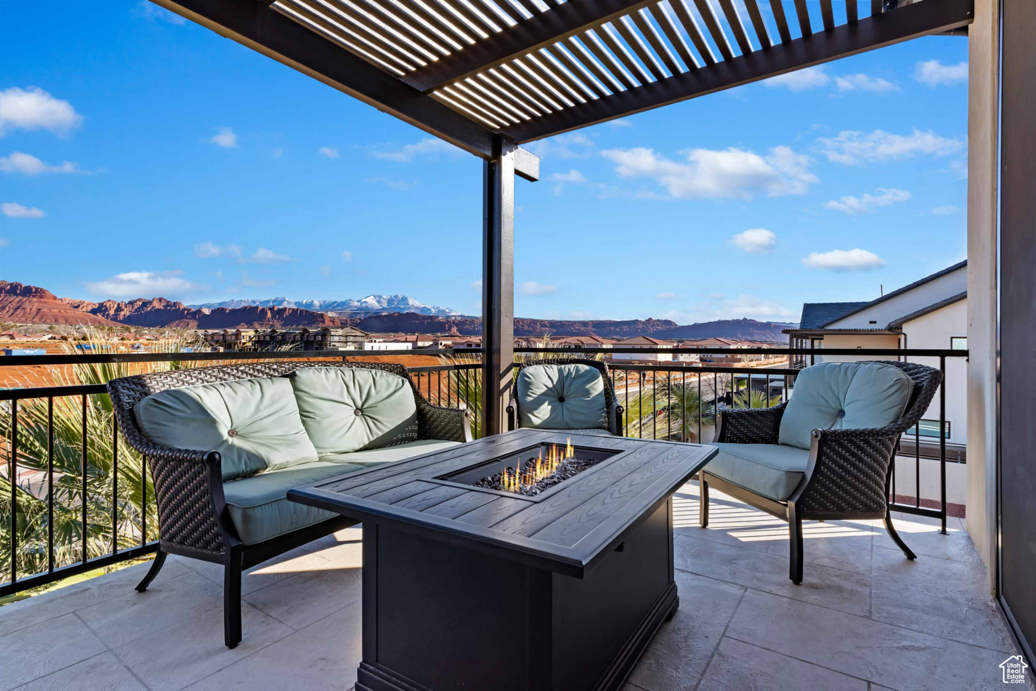 View of patio featuring a mountain view, an outdoor living space with a fire pit, and a pergola