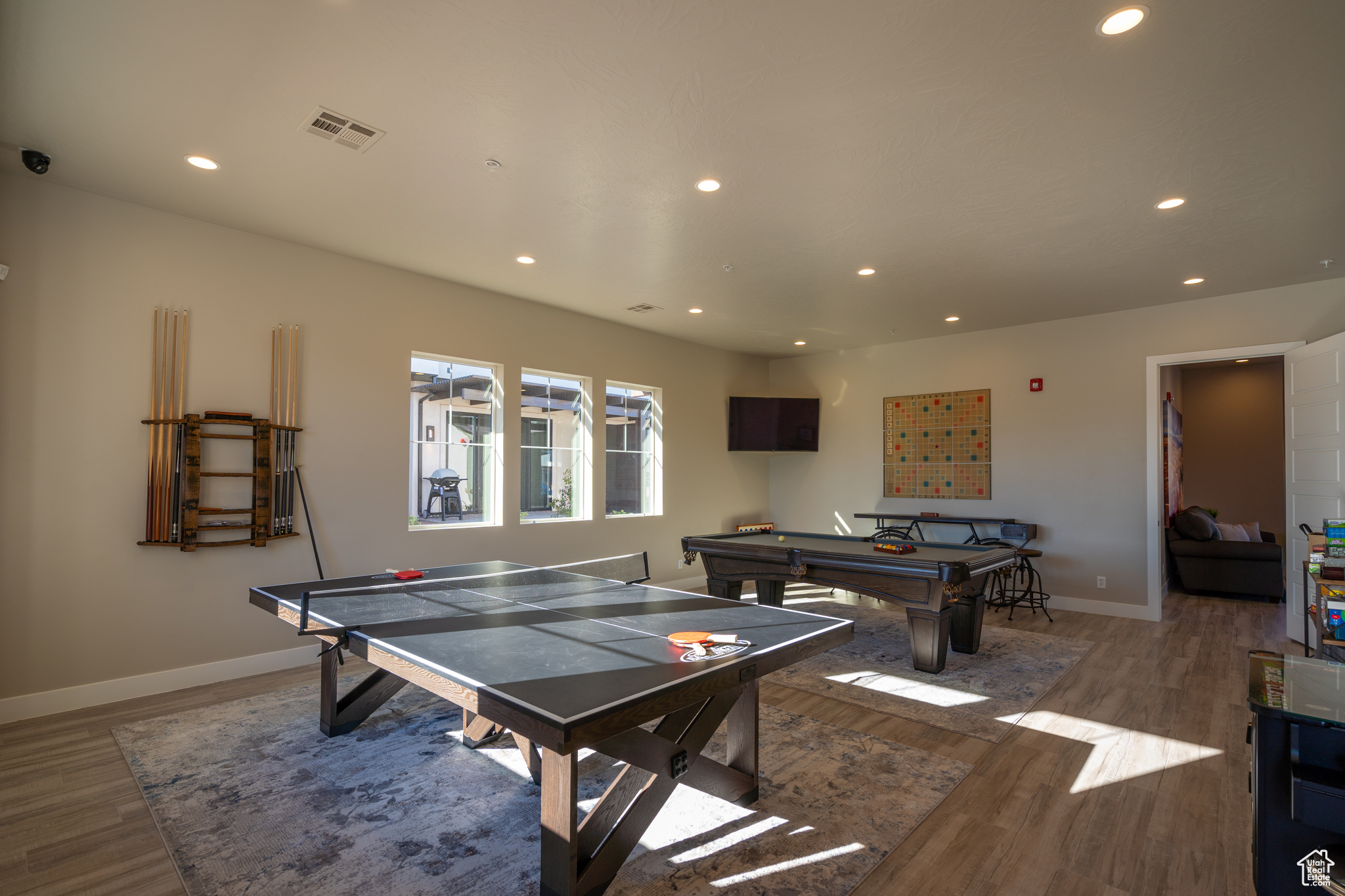 Club house Rec room featuring hardwood / wood-style flooring and billiards