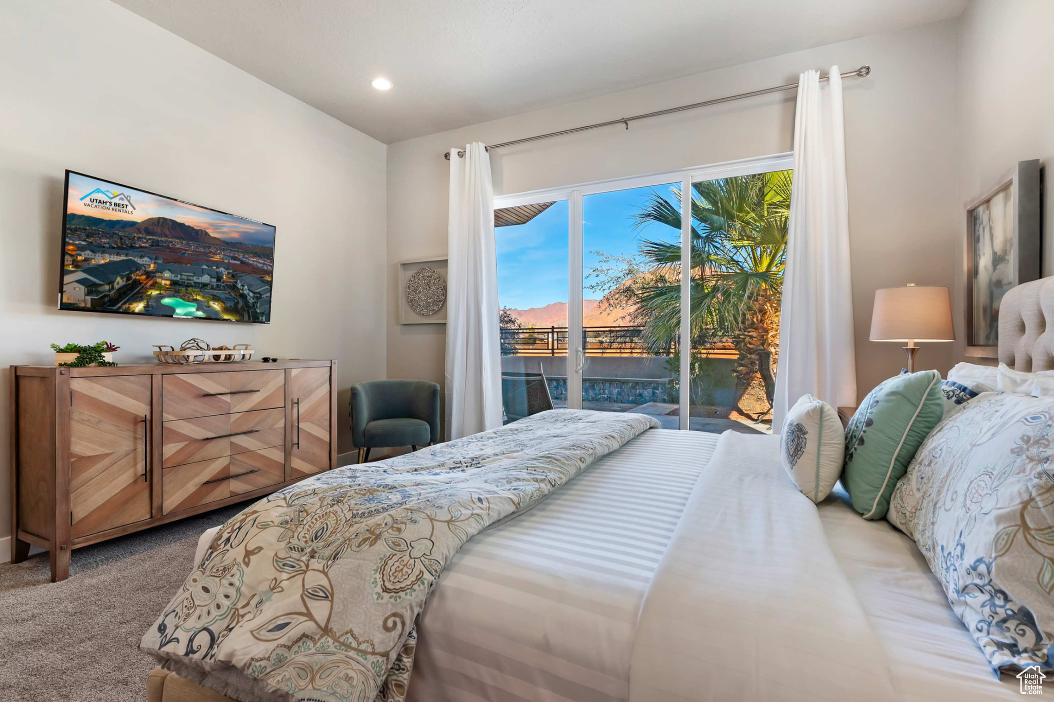 Carpeted bedroom featuring access to outside