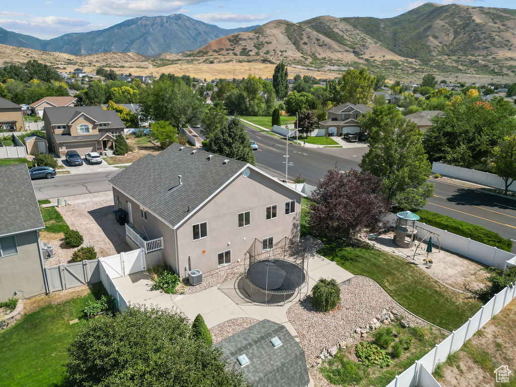 Birds eye view of property with a mountain view