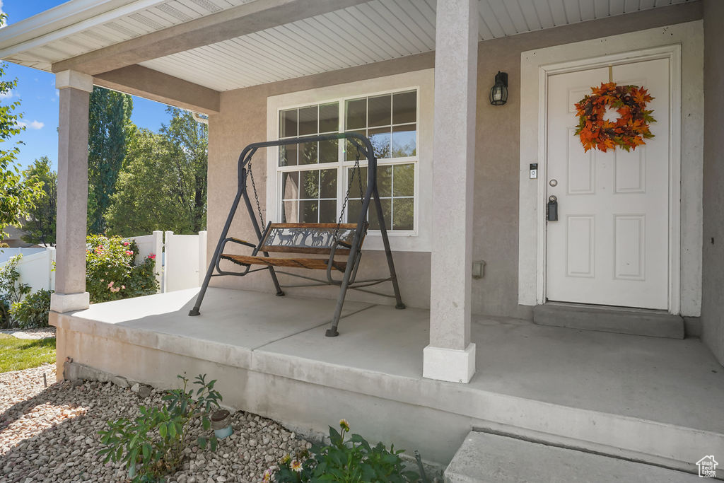 Property entrance featuring covered porch