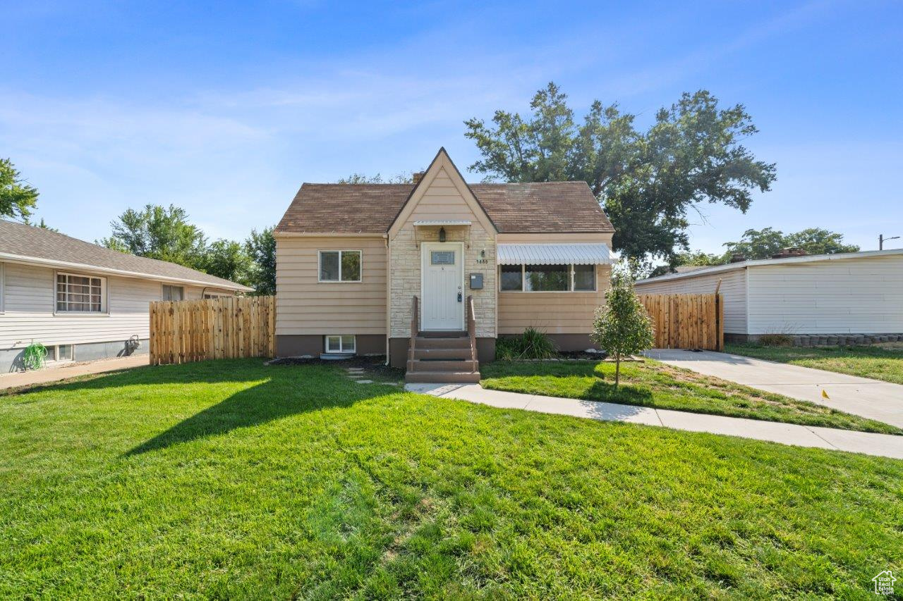 View of front of property with a front lawn