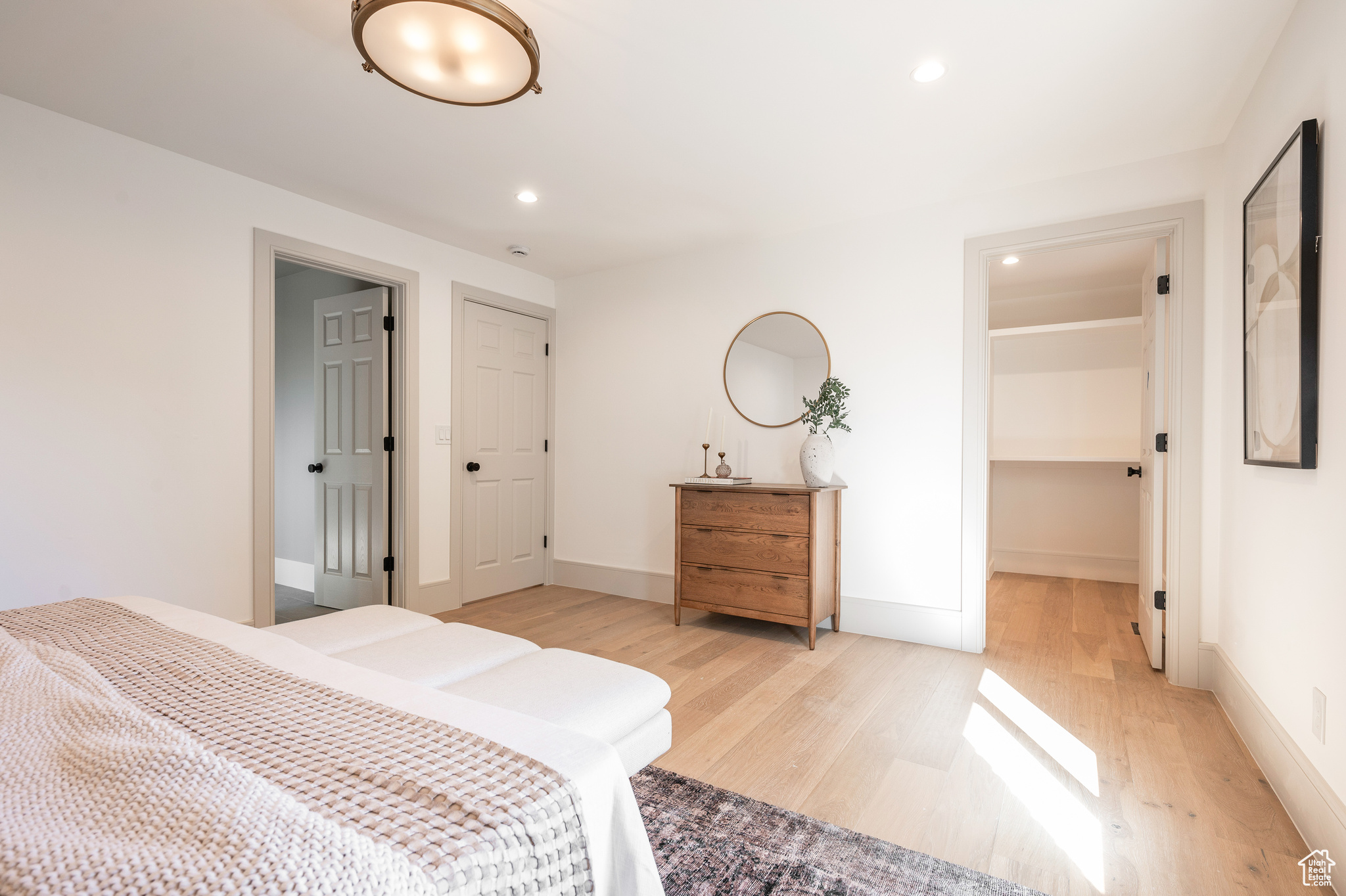 Bedroom with light hardwood / wood-style floors