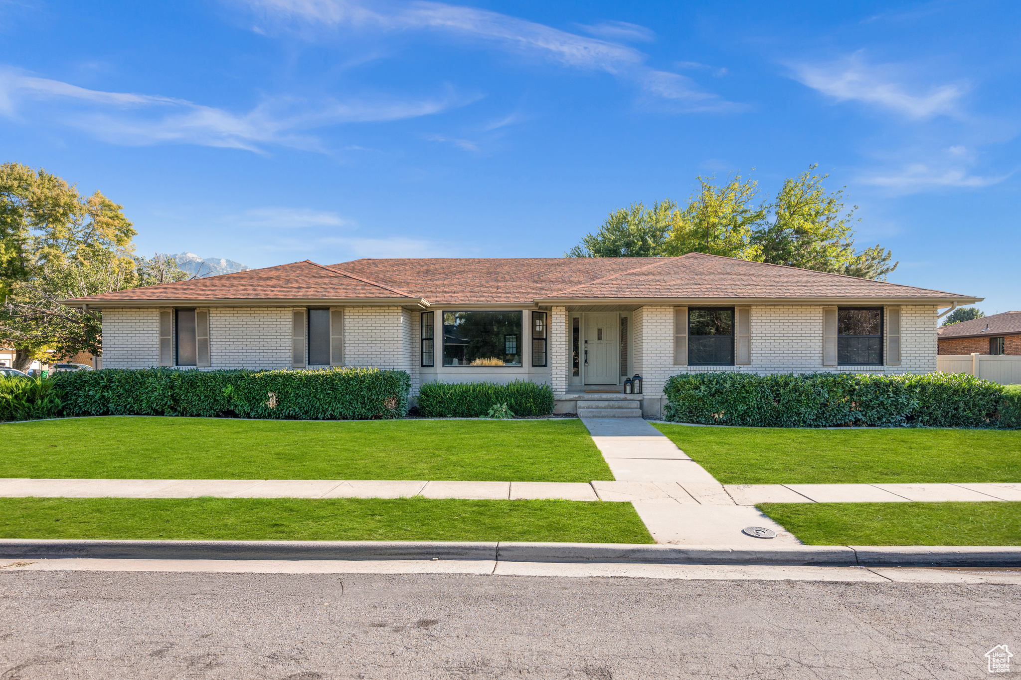 Single story home featuring a front yard