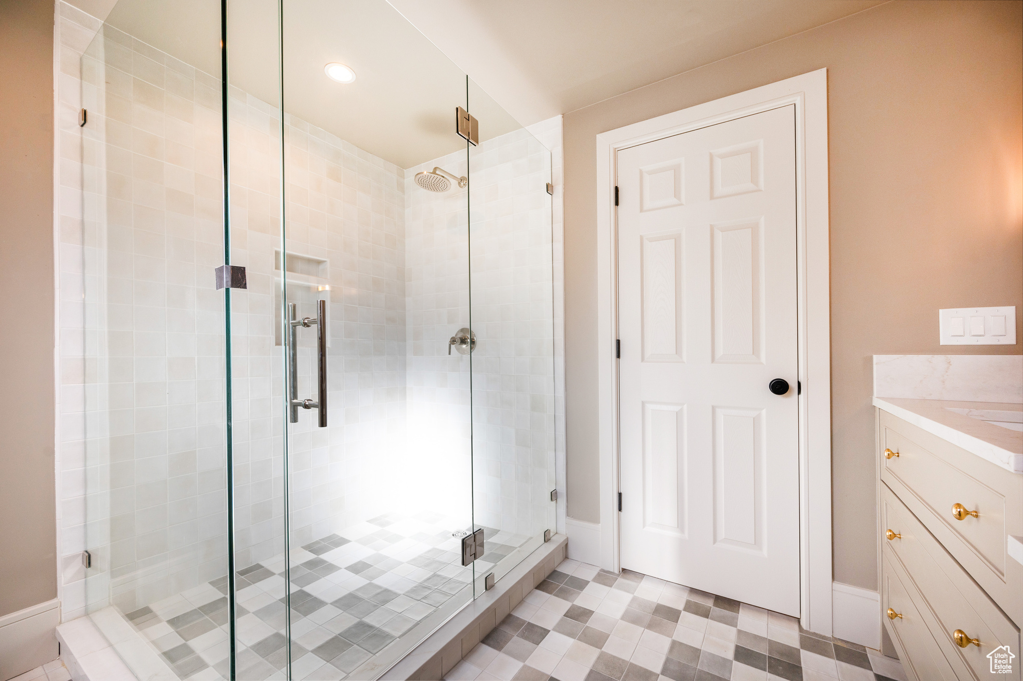 Bathroom featuring walk in shower and vanity