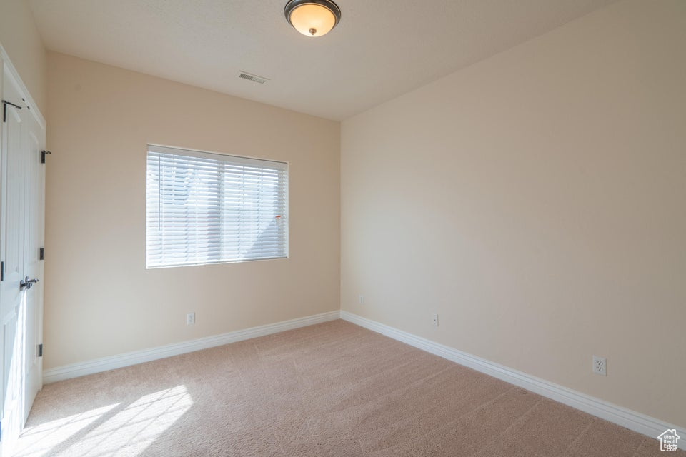 View of carpeted spare room