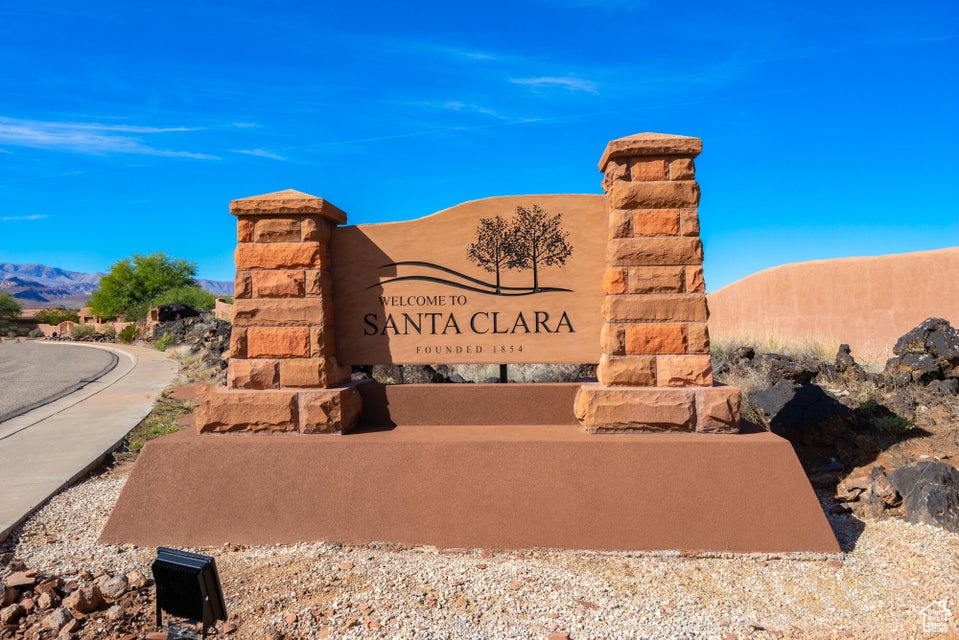 Community / neighborhood sign with a mountain view