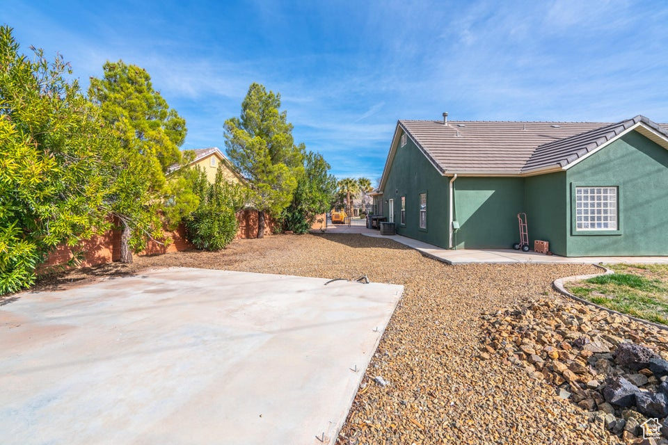 View of side of property with a patio area