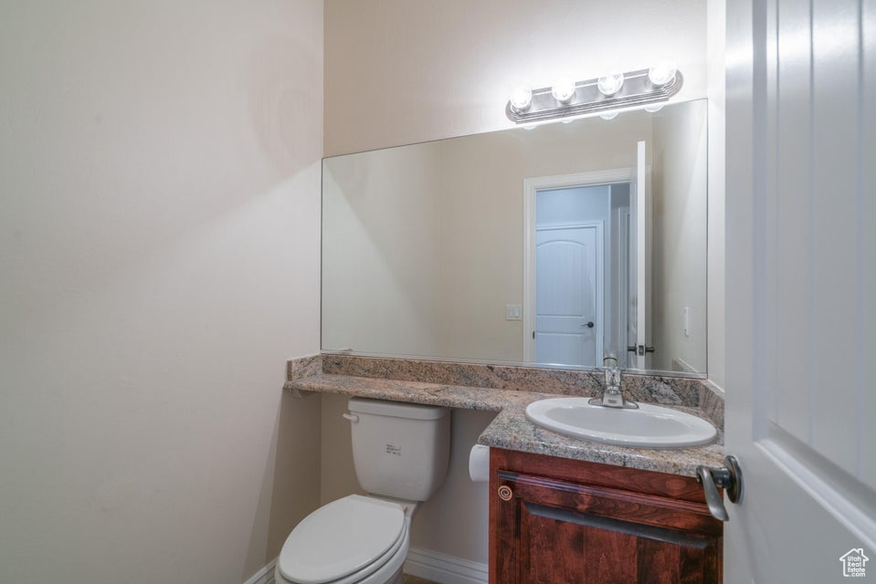 Bathroom featuring vanity and toilet