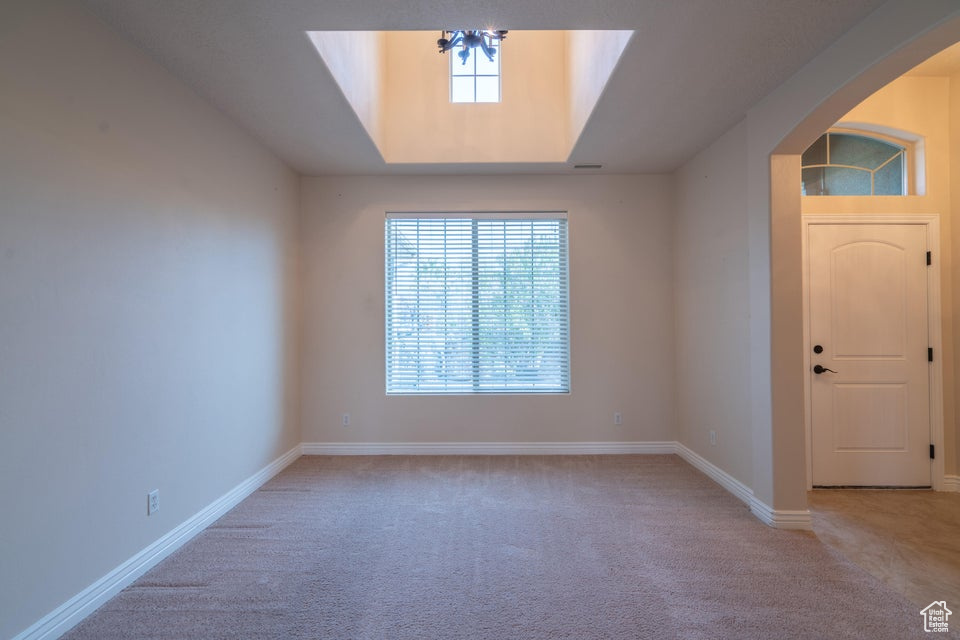 Foyer entrance with carpet floors