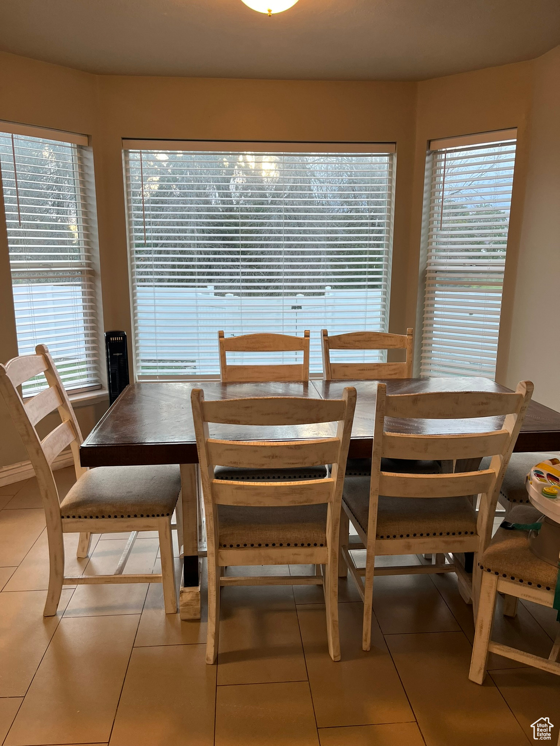 Tiled dining space with plenty of natural light