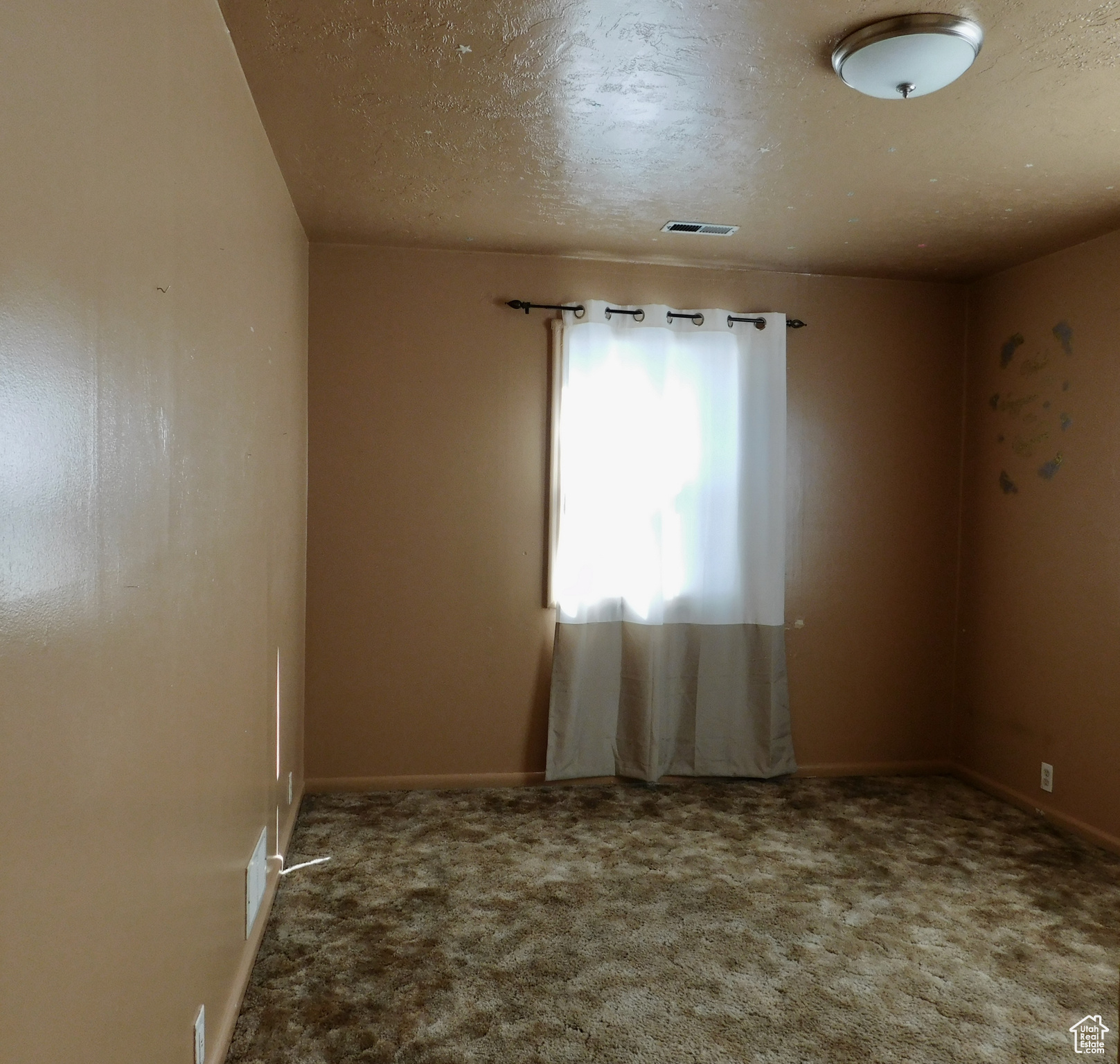 Bedroom 1 -There are natural wood floors under the carpet.