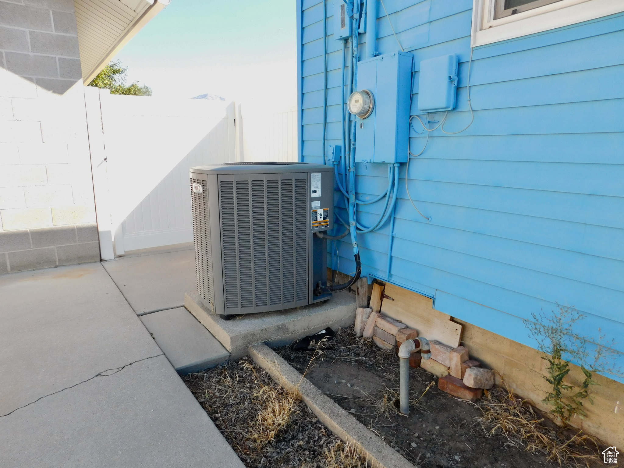 Oversized AC unit and a capped off water well.