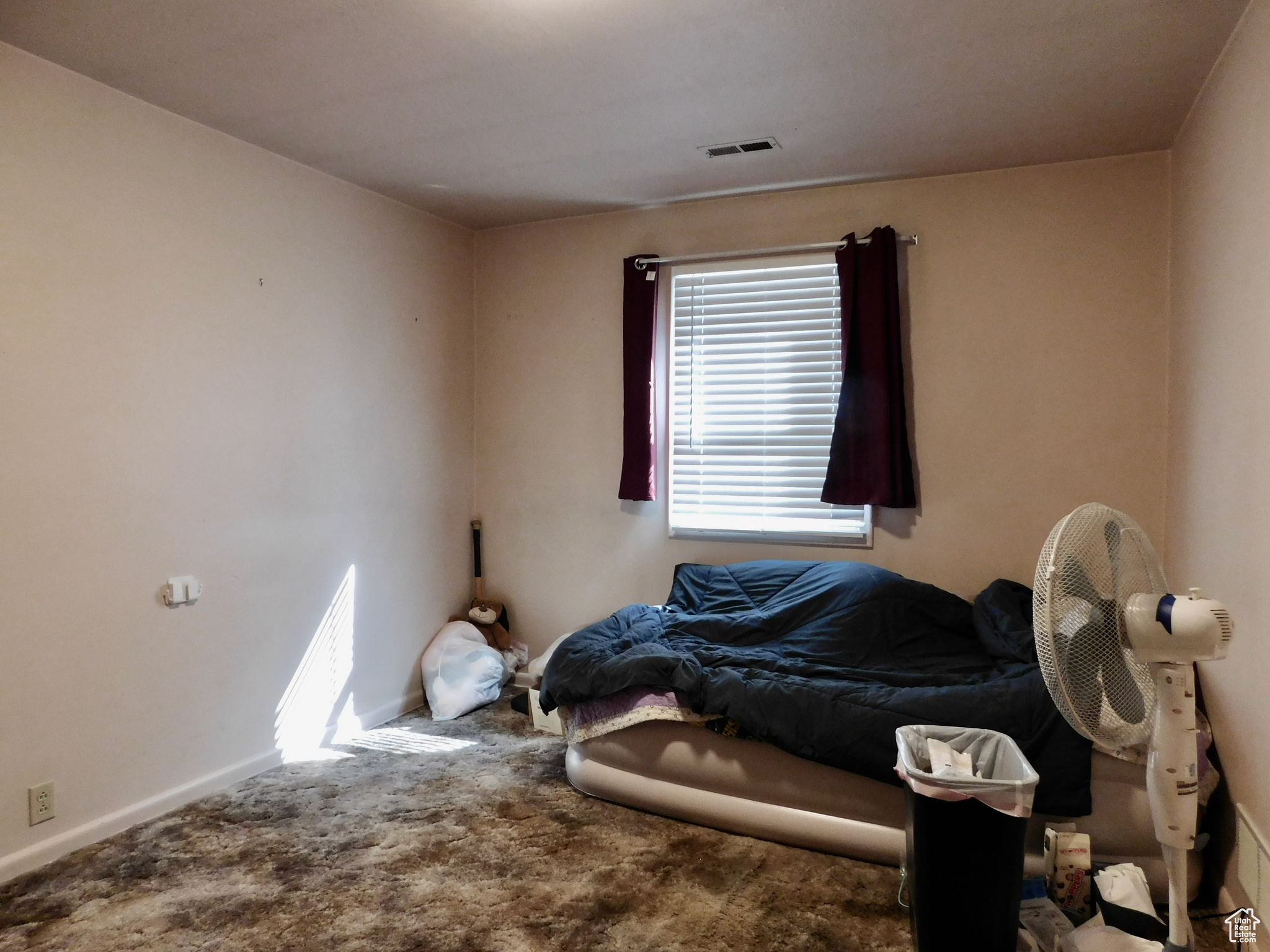 Bedroom 2 - There are natural wood floors under the carpet.