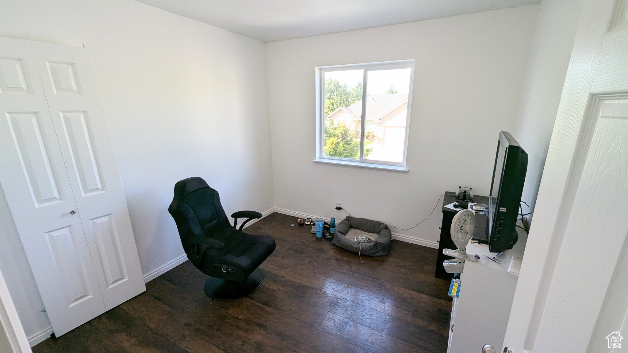 Interior space with dark hardwood / wood-style floors