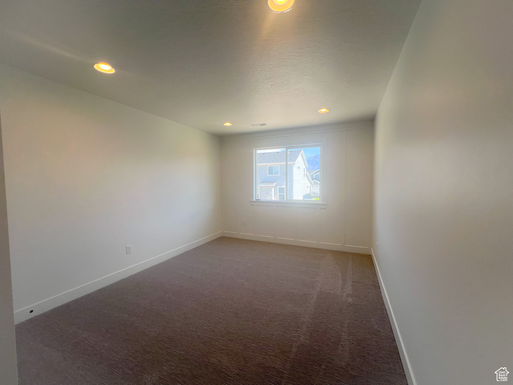 Spare room with carpet floors