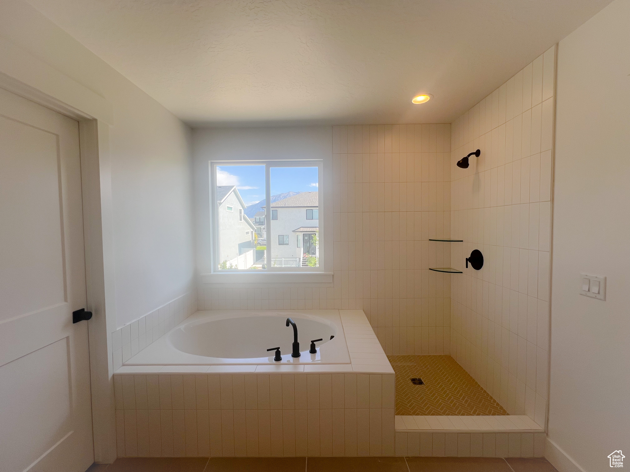 Bathroom featuring separate shower and tub