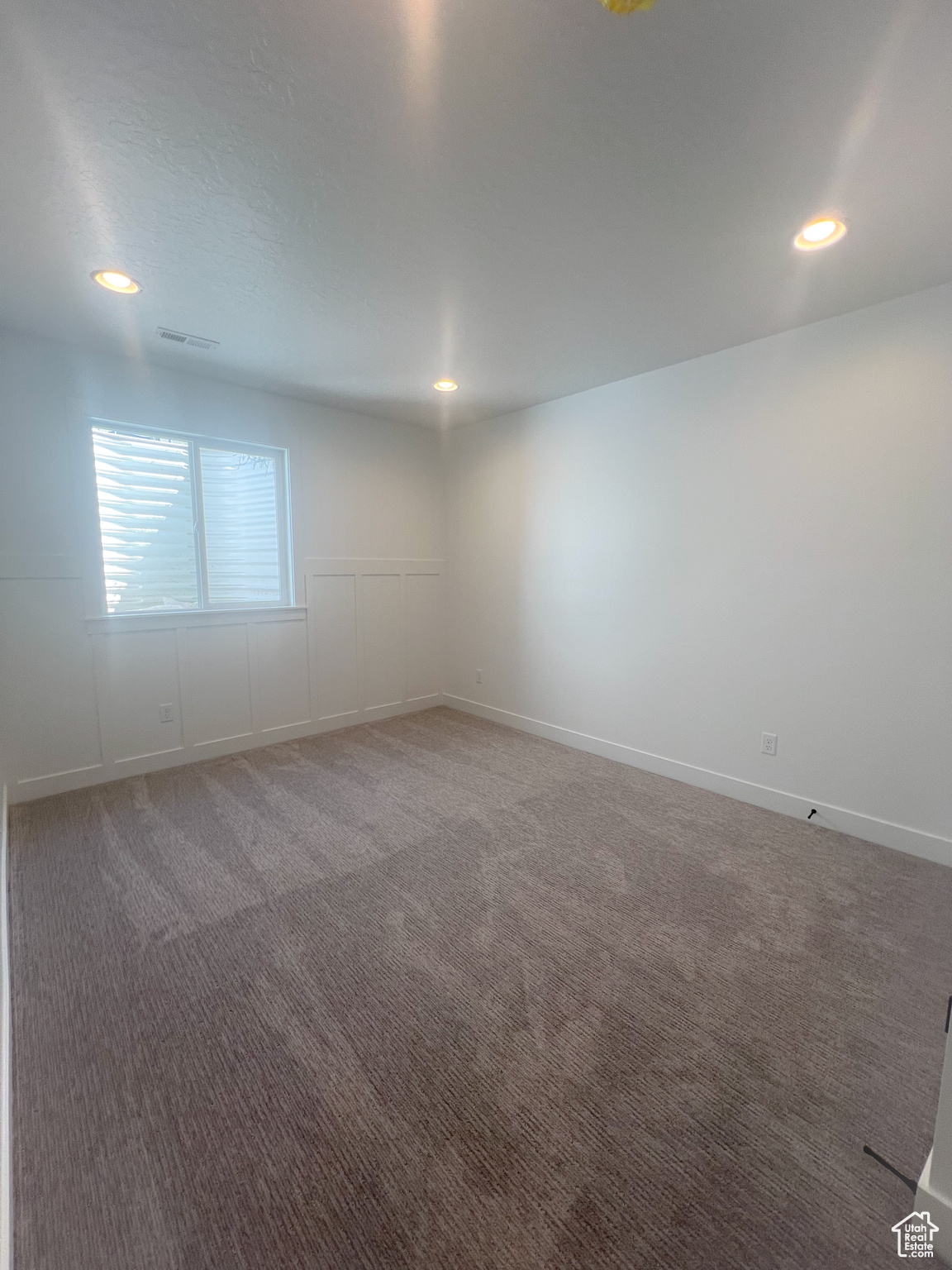 Empty room with carpet flooring