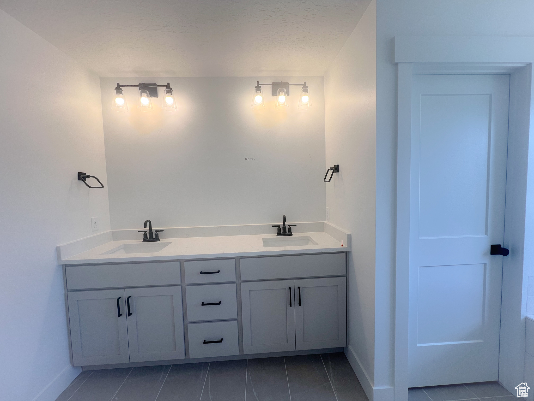 Bathroom featuring vanity and tile patterned floors