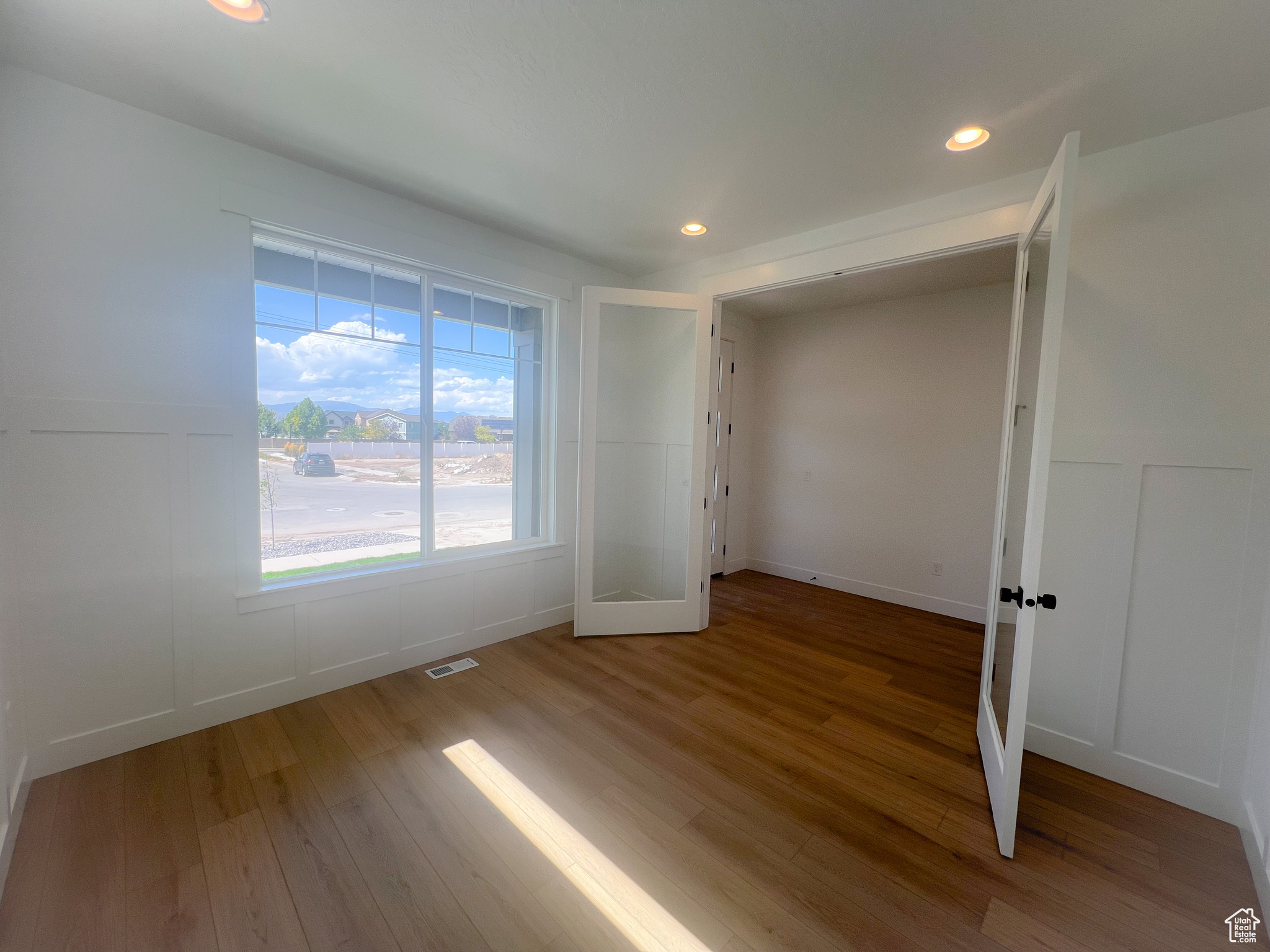 Spare room with hardwood / wood-style floors