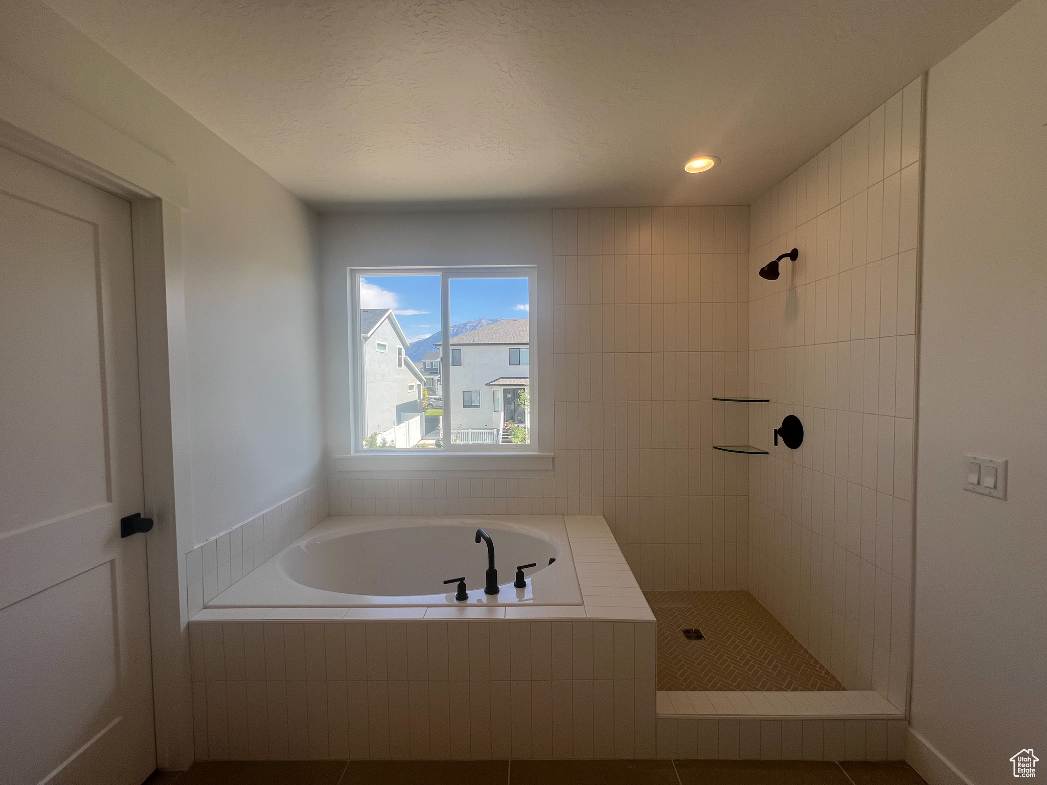 Bathroom with shower with separate bathtub